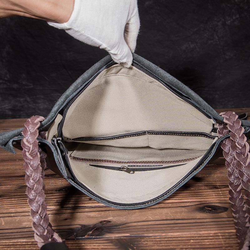 Handbag with braided handle on a wooden surface