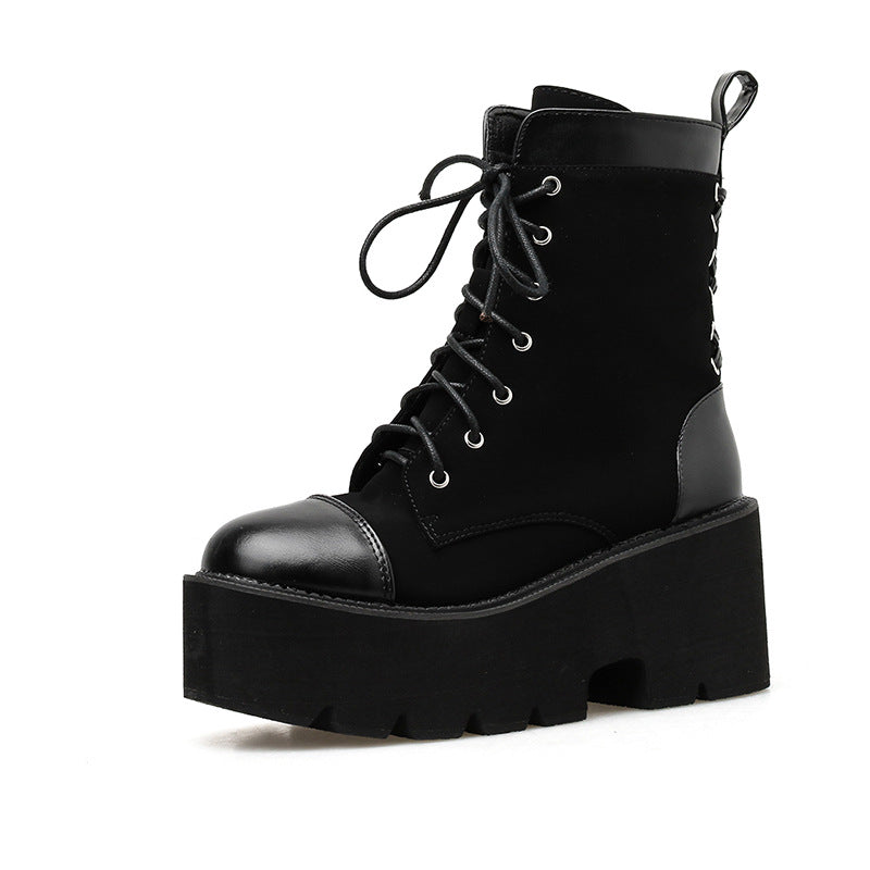 Black platform boot with lace-up design on a white background