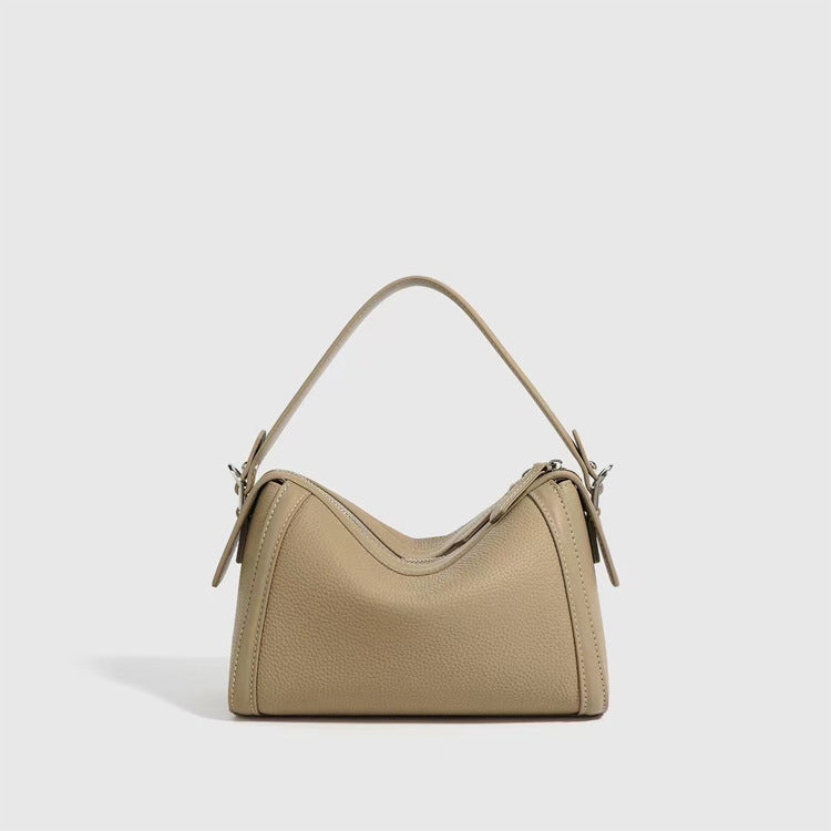 Beige handbag on a light gray background