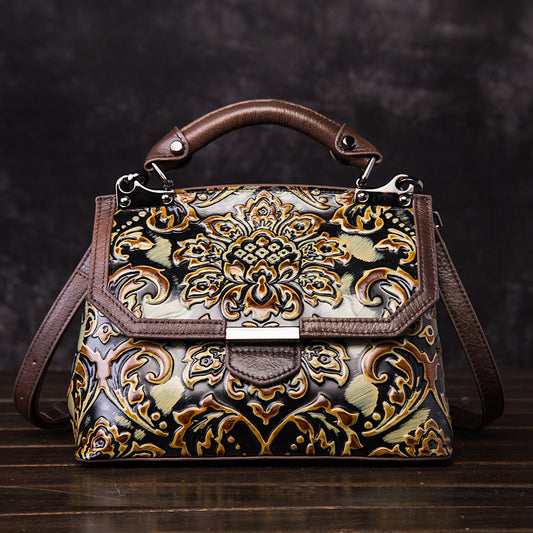 Decorative handbag with intricate patterns on a dark background