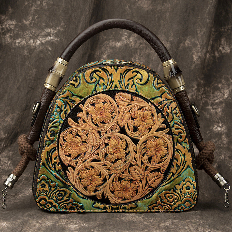 Decorative leather bag with intricate patterns on a textured gray background