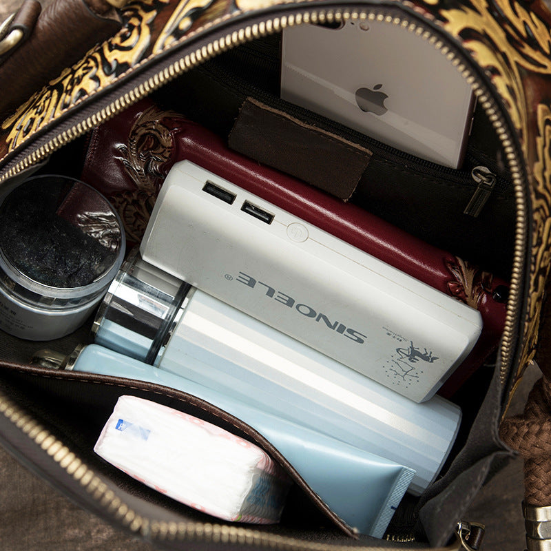 SINONELE power bank inside a handbag with other items