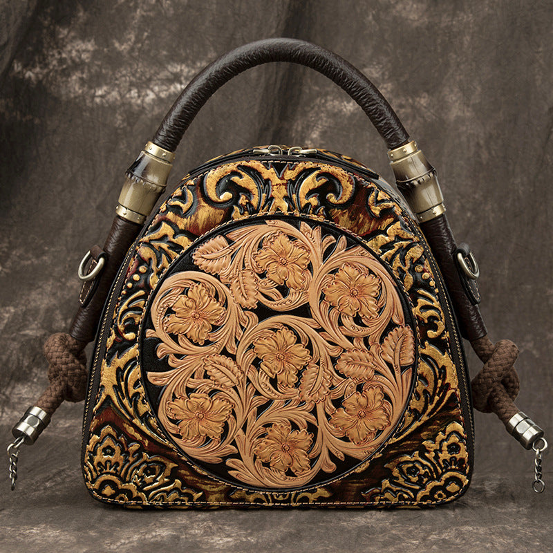Decorative leather bag with intricate patterns on a textured background