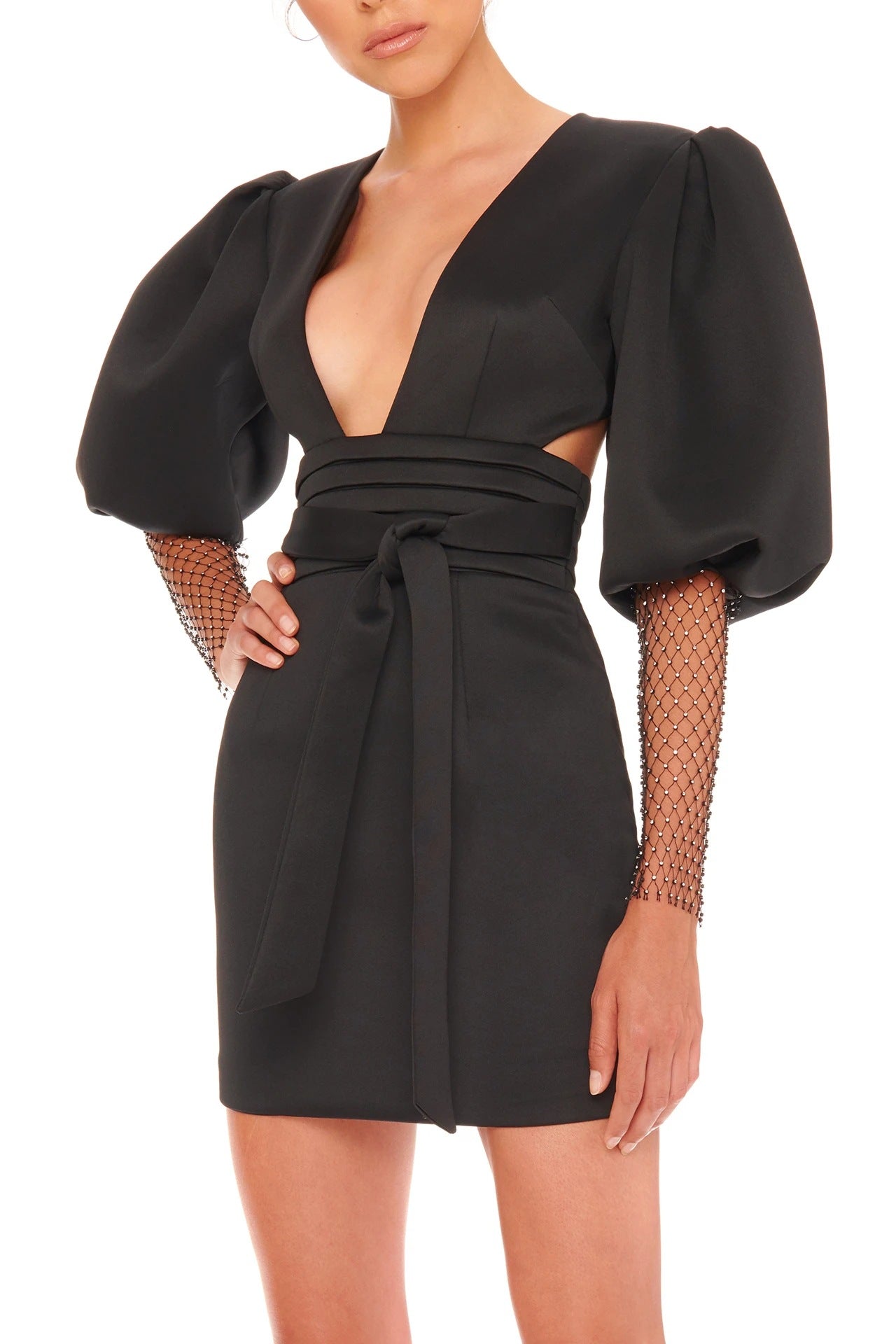 Black dress with puff sleeves and cut-out design on a white background