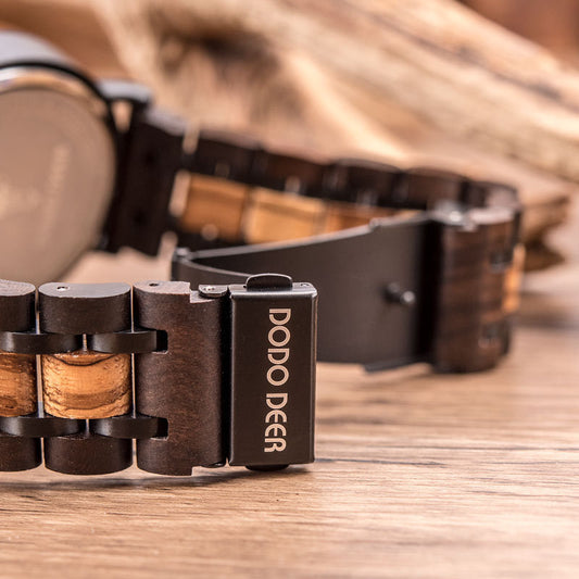 Close-up of a wooden bracelet with 'Dodo Deer' branding on a wooden surface.