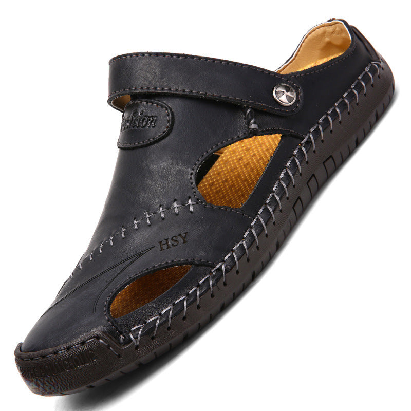 Black sandal with brown interior on a white background