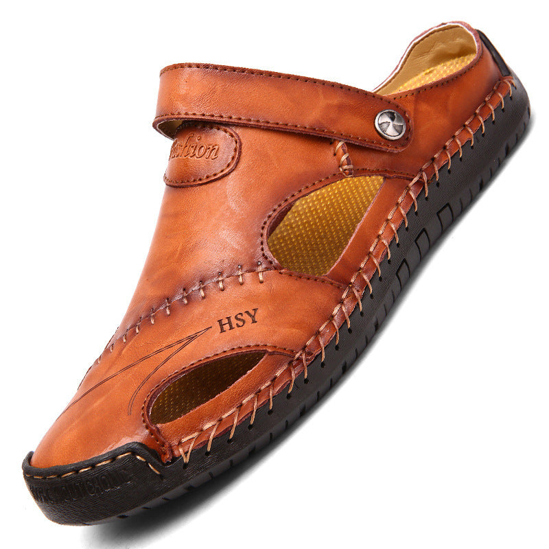 Brown sandal with black sole on a white background