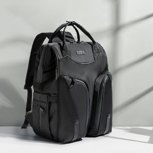 Black backpack on a light gray background