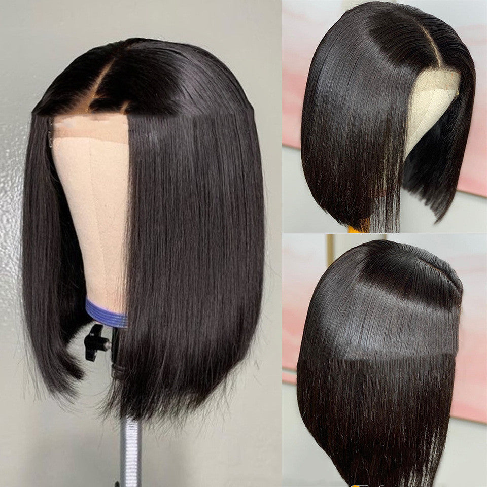 Black straight wig on a mannequin head with close-up details.