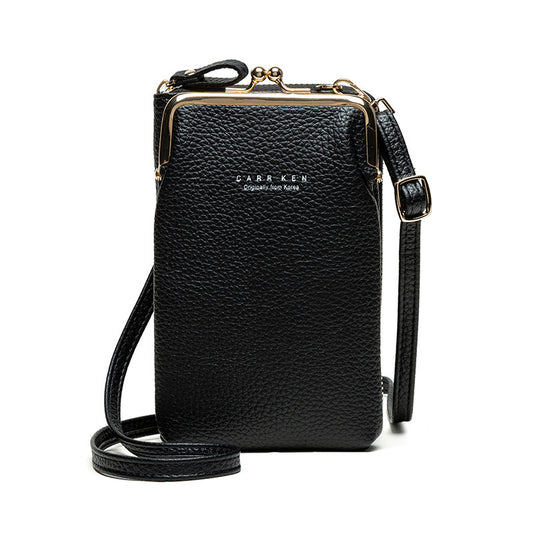 Black leather crossbody bag with gold accents on a white background