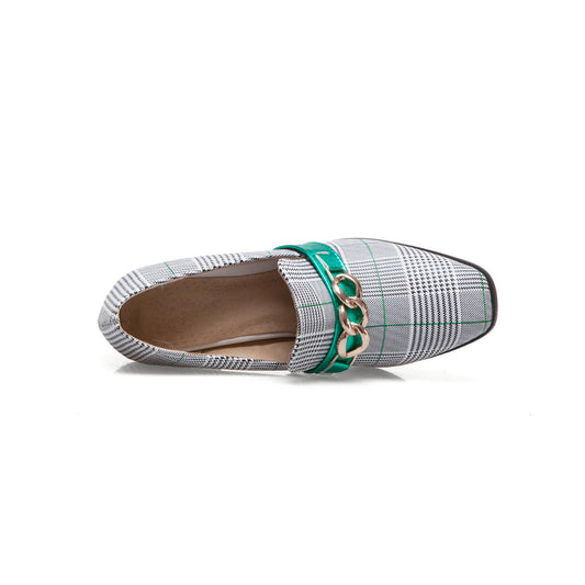Plaid shoe with green chain detail on a white background