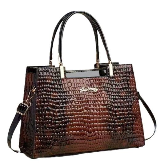 Brown textured handbag with a visible brand name on a white background