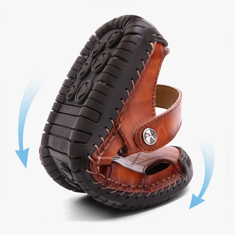 Brown sandal with black sole on a white background