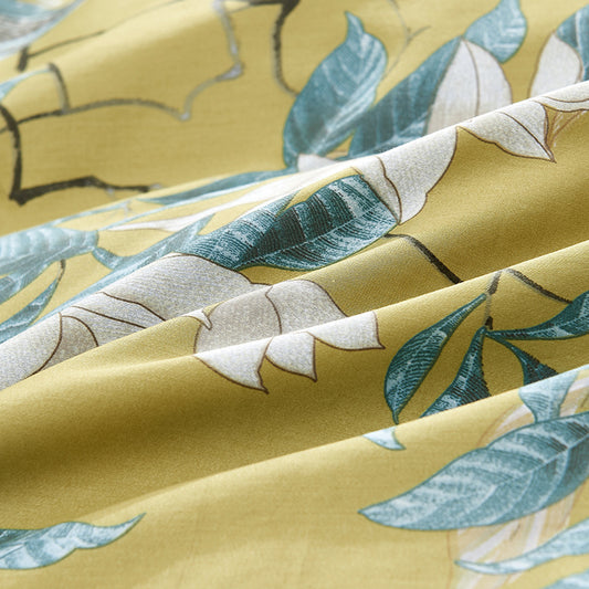 Close-up of fabric with leaf pattern on a yellow background