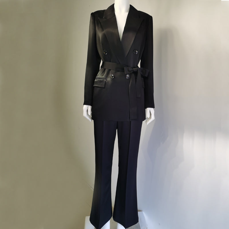 Black suit on a mannequin against a neutral background by millivan