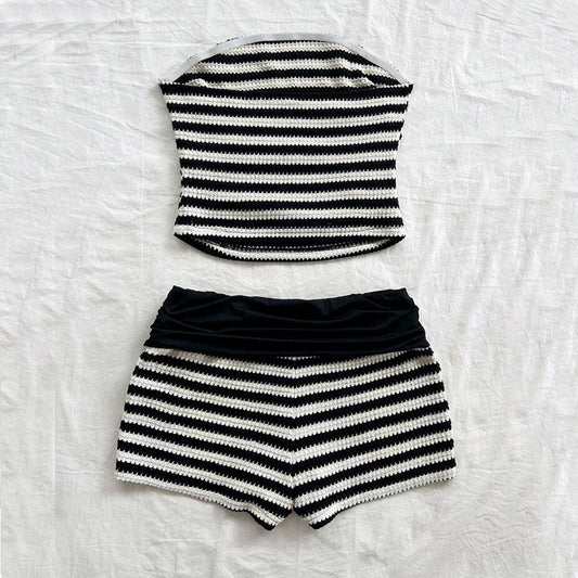 Black and white striped sleeveless top and shorts set on a textured white background