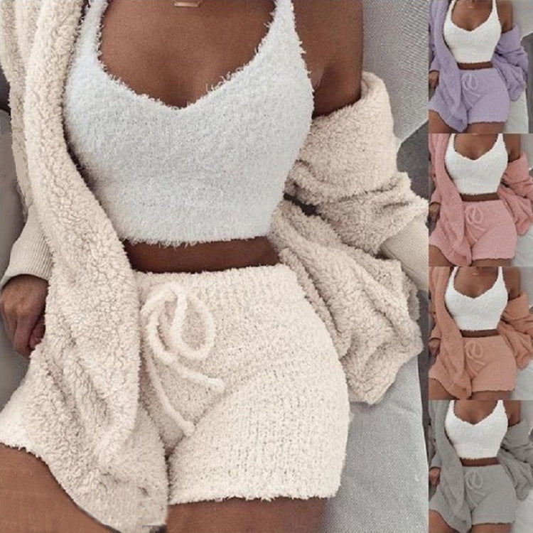 White fuzzy top and shorts set with a beige cardigan, shown on a person.