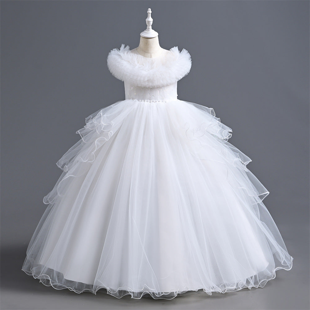 White ball gown on a mannequin against a gray background