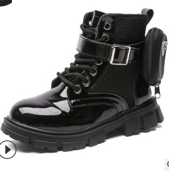 Black high-top boots with glossy finish on a white background