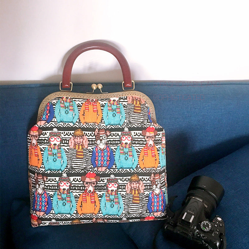 Colorful handbag with a pattern of cartoon characters on a blue surface