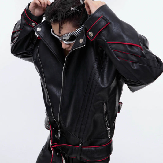Person wearing a black leather jacket with red accents on a white background