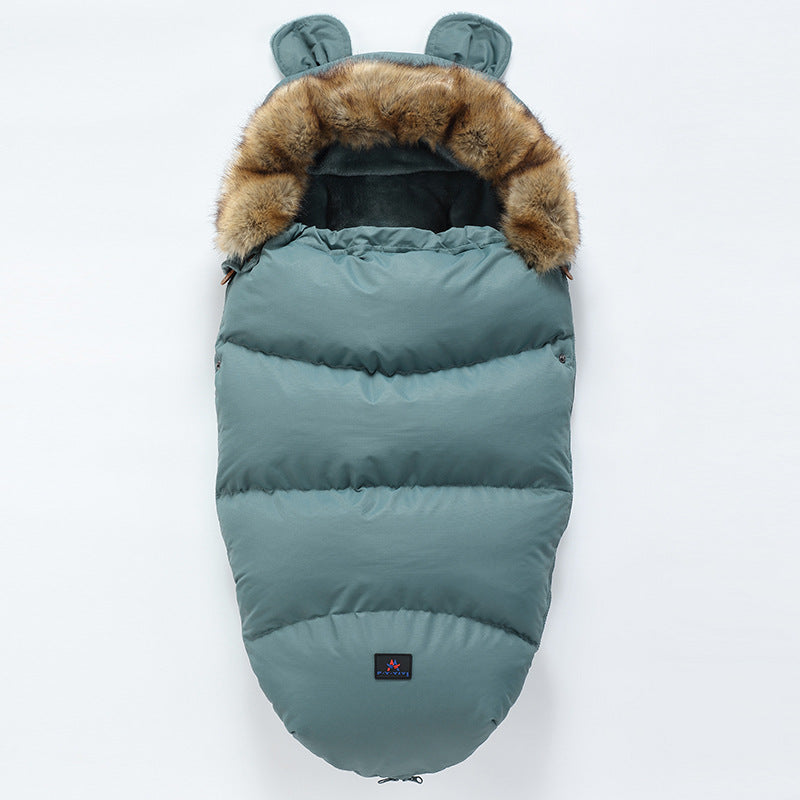 Teal baby sleeping bag with fur trim on a white background