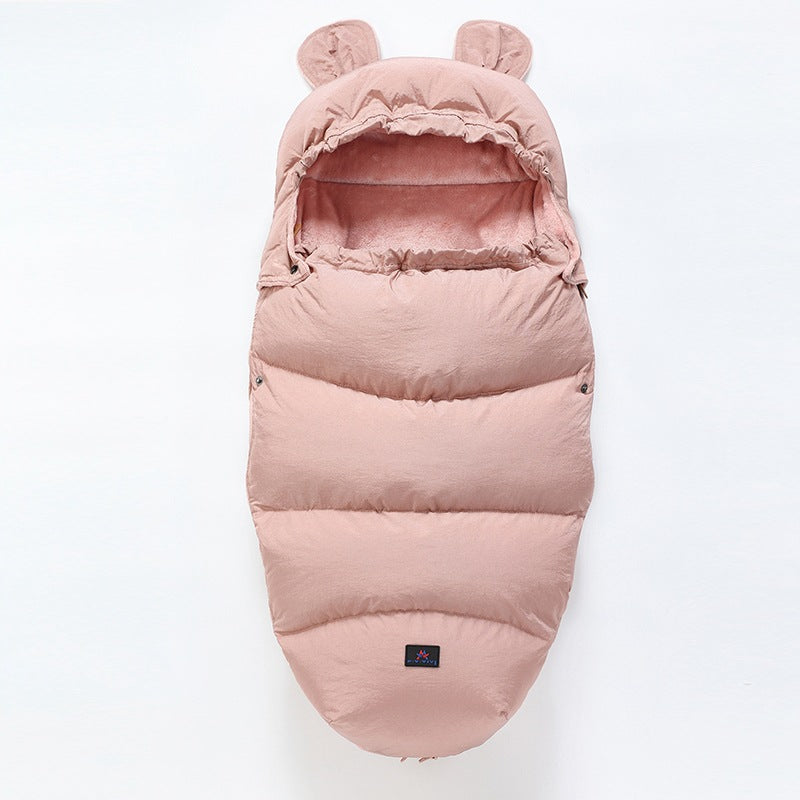 Pink baby sleeping bag with bear ears on a white background