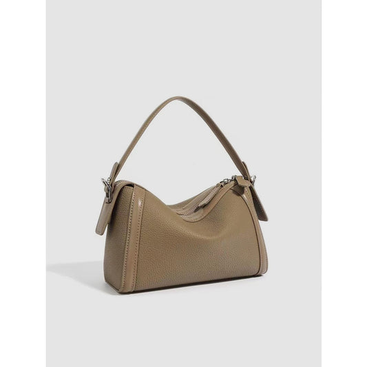 Beige handbag on a light gray background