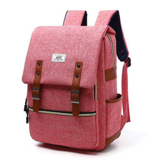 Pink backpack with brown straps on a white background
