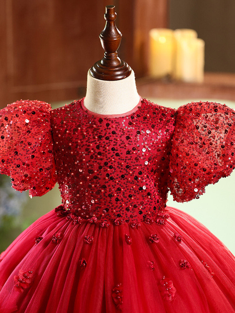 Red sequin dress on a mannequin with a blurred background