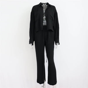 Black outfit on a mannequin against a white background