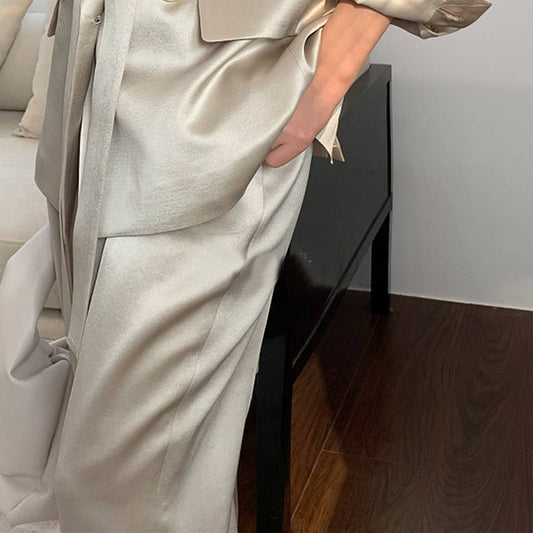Person wearing a beige suit in an indoor setting by millivan