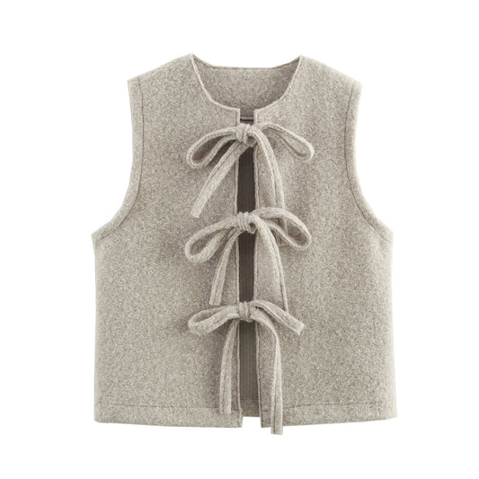 Gray vest with bow details on a white background