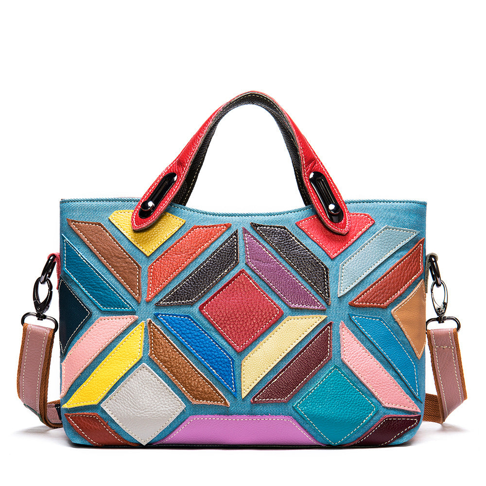 Colorful geometric-patterned handbag with a shoulder strap on a white background
