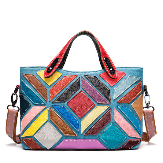 Colorful geometric-patterned handbag with a shoulder strap on a white background