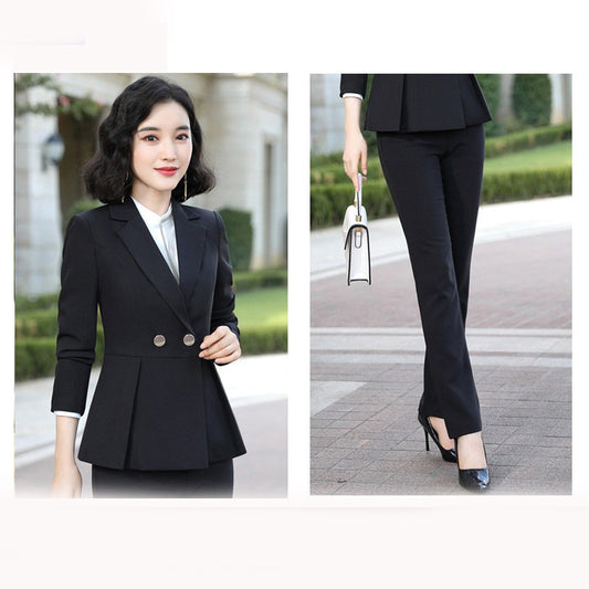Woman wearing a black blazer and pants with a white shirt, standing outdoors.