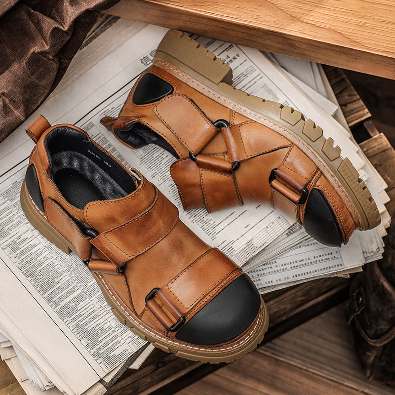 Brown leather shoes with black soles on a newspaper background