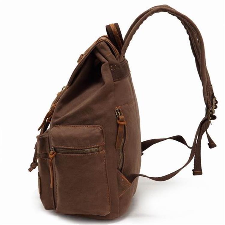 Brown backpack with braided handle on a white background