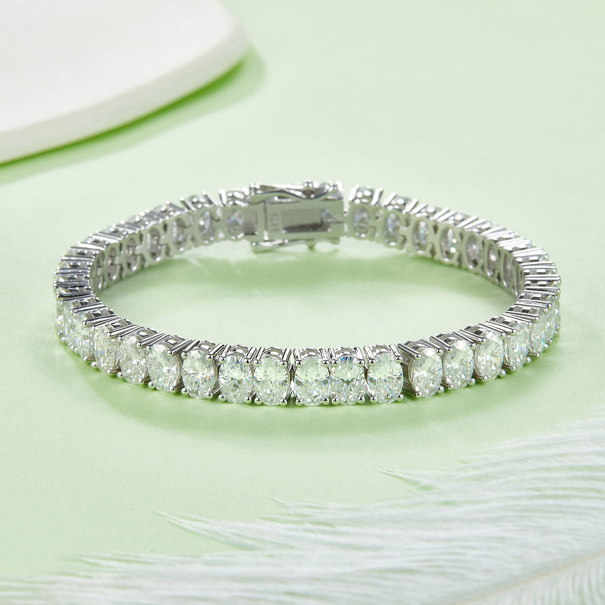 Bracelet Moissanite is a single-row oval cut moissanite tennis bracelet in platinum-plated S925 sterling silver — GRA certified, D Color, VVS1 clarity, and set with precision-cut 6×4mm oval moissanite stones from end to end.