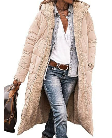 Person wearing a long beige puffer coat with a white shirt and blue jeans on a white background