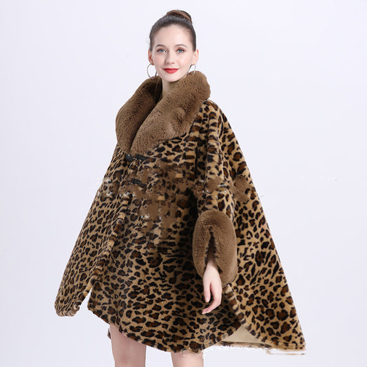 Woman wearing a leopard print coat with brown fur trim on a white background