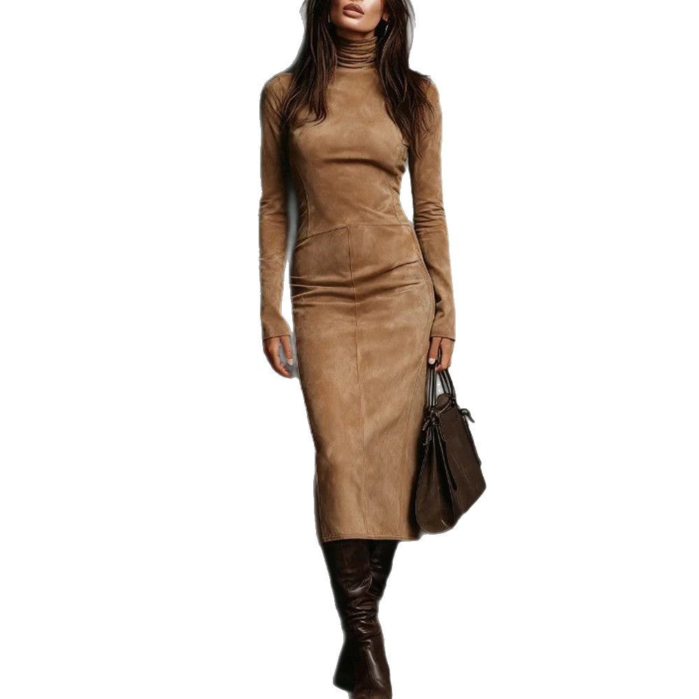Woman wearing a brown suede dress with a plain background