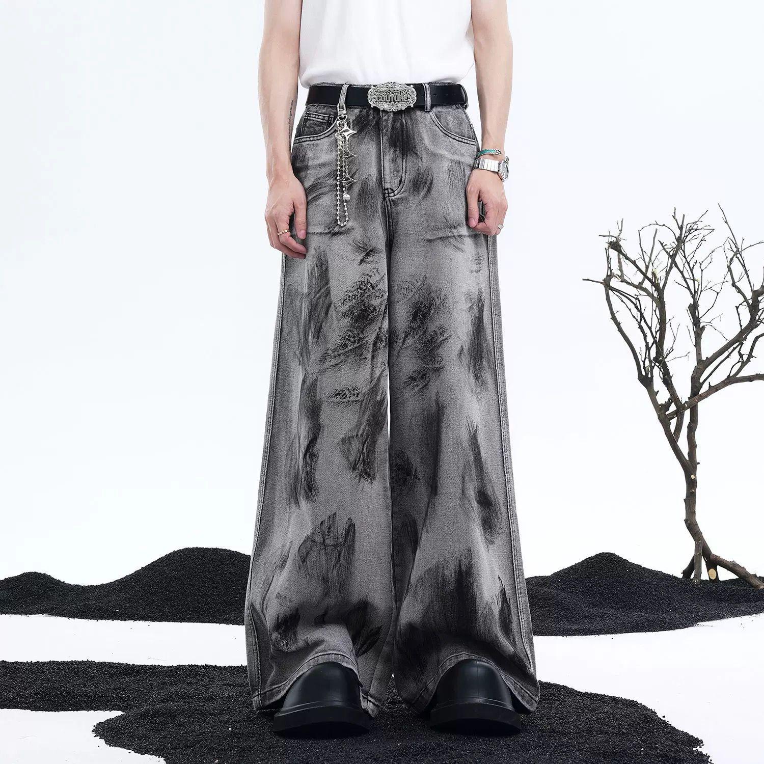 Person wearing wide-leg jeans with a white background and decorative elements.