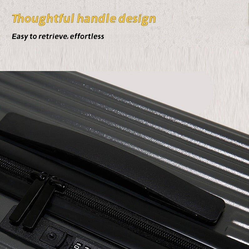 Close-up of a black suitcase handle with text on a light gray background