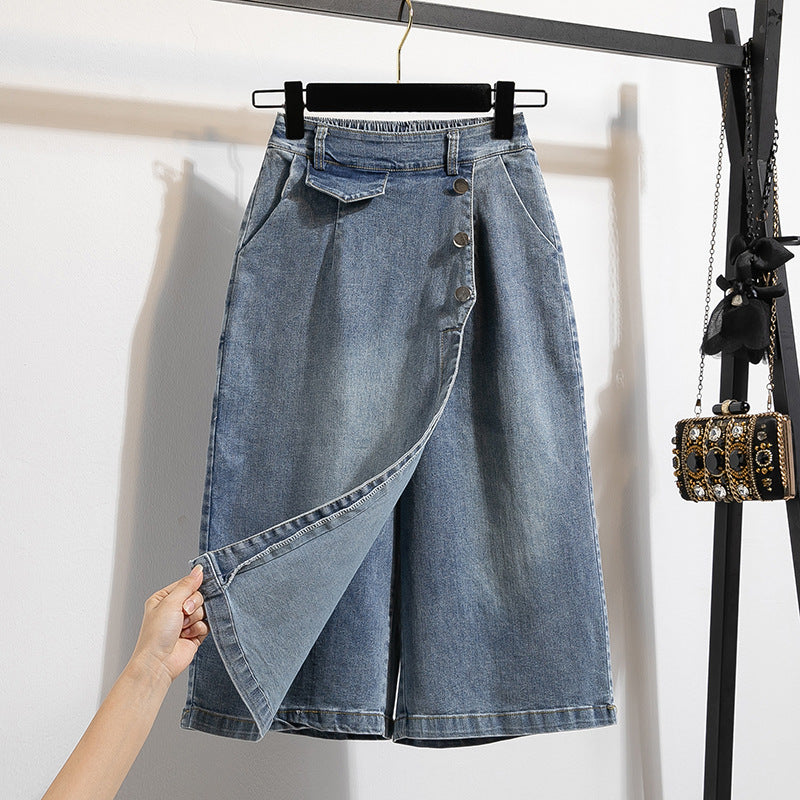 Blue denim skirt on a hanger against a white background