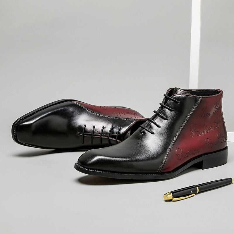 Black and red leather shoes on a light gray background with a pen.