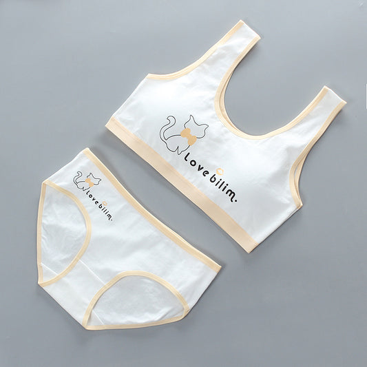 White underwear set with beige trim and 'I love bilim' text on a gray background