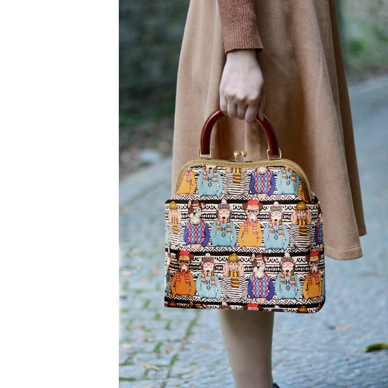 Person holding a patterned handbag with a blurred background