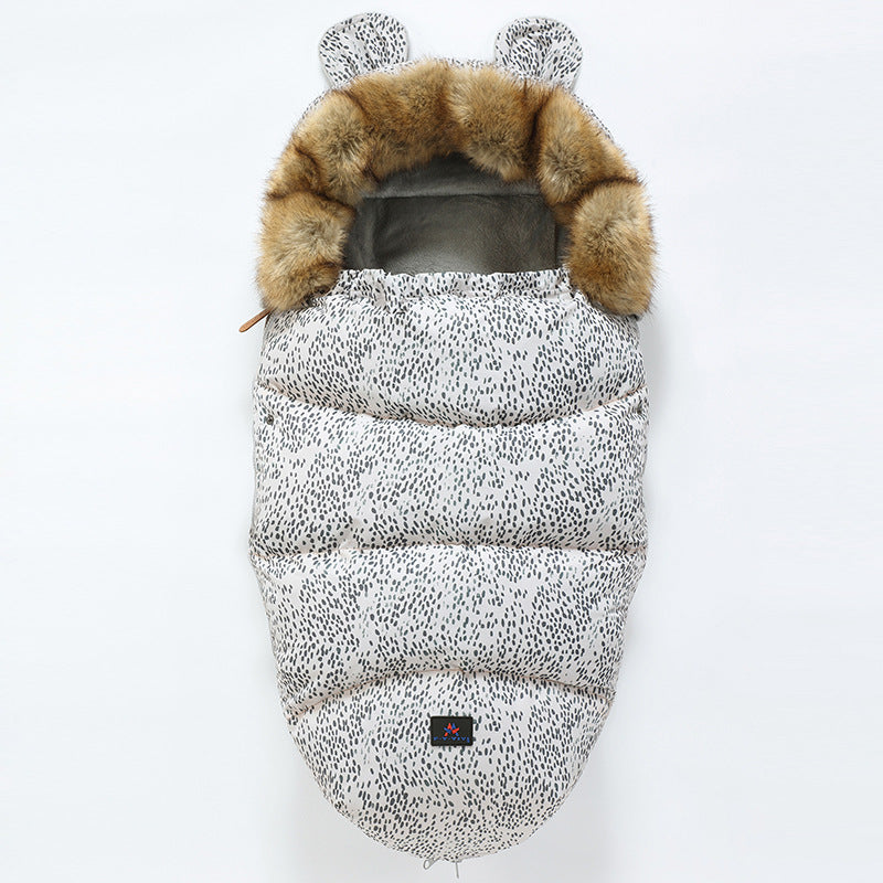 Baby sleeping bag with leopard print and fur hood on a white background