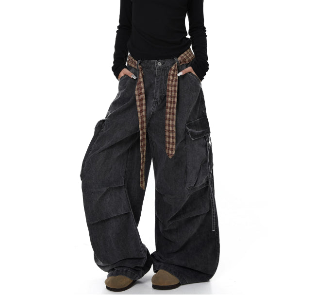 Dark gray wide-leg pants with plaid accents on a white background